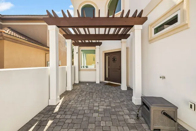 a view of a hallway with wooden shelves