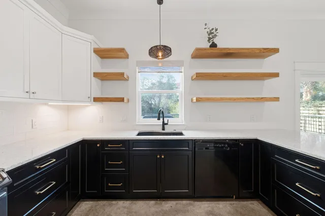 a kitchen with a sink and cabinets