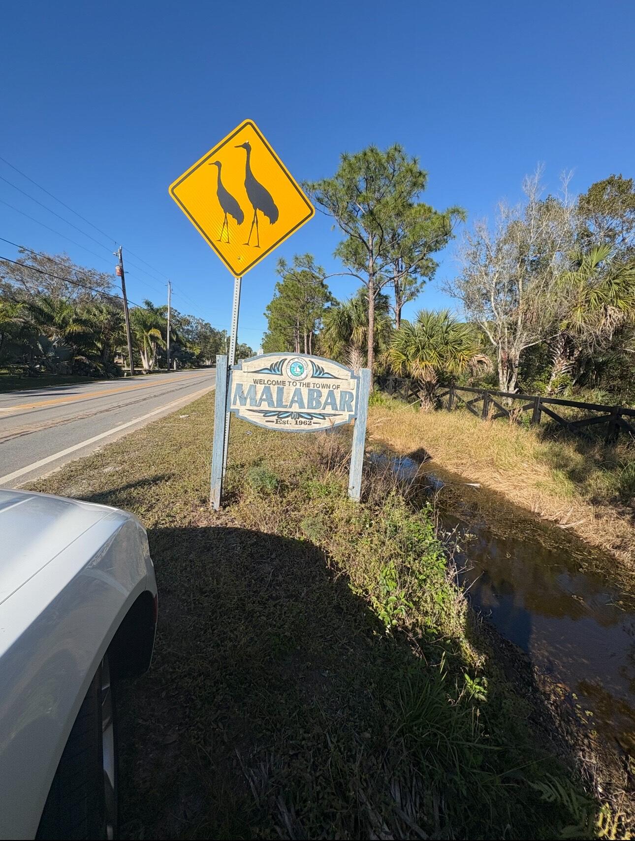3305 Weber Road Grant Valkaria, FL 32950 - Photo 1 of 7 a view of a street with a building in the background