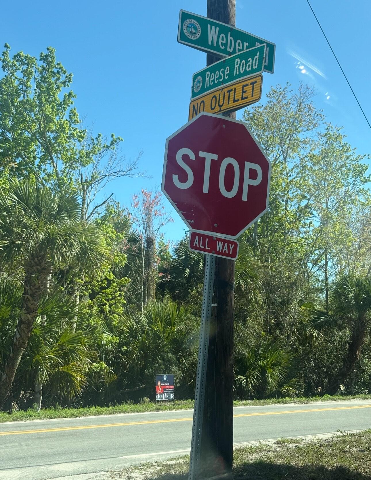 3305 Weber Road Grant Valkaria, FL 32950 - Photo 4 of 7 a sign that is on a pole