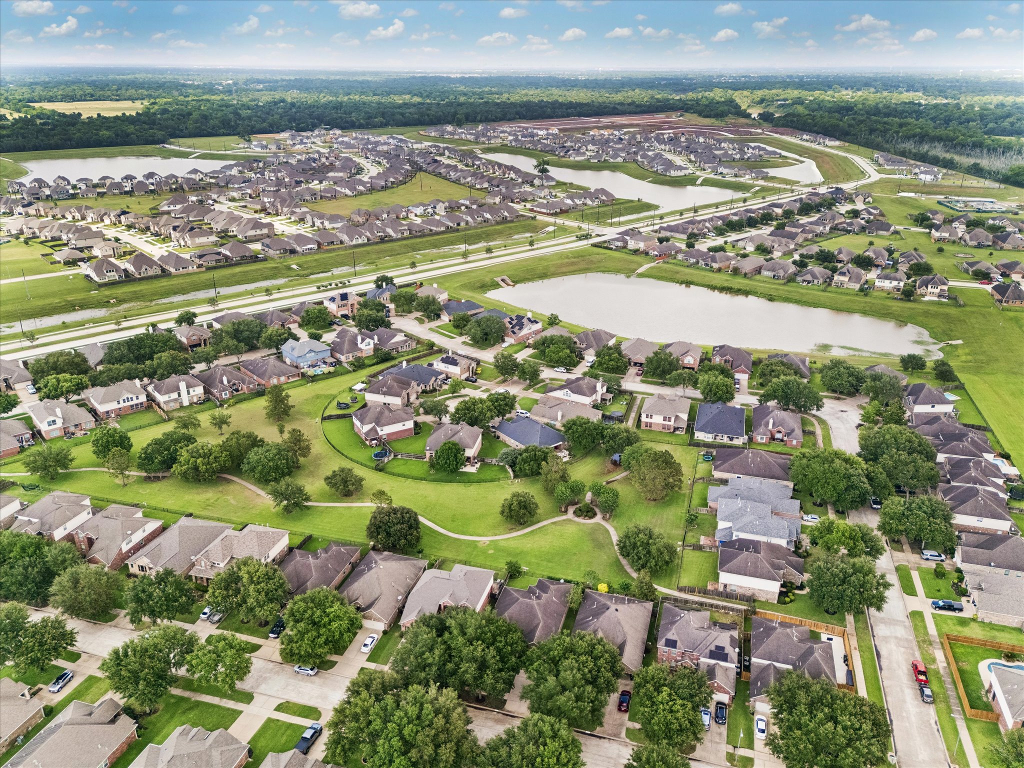 2214 Wembley Way Rosenberg, TX 77471 - Photo 34 of 35 Aerial perspective showcasing a residential community with numerous single-family homes