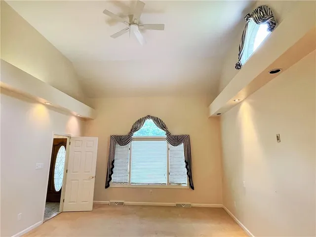 a view of a hallway with wooden shelves