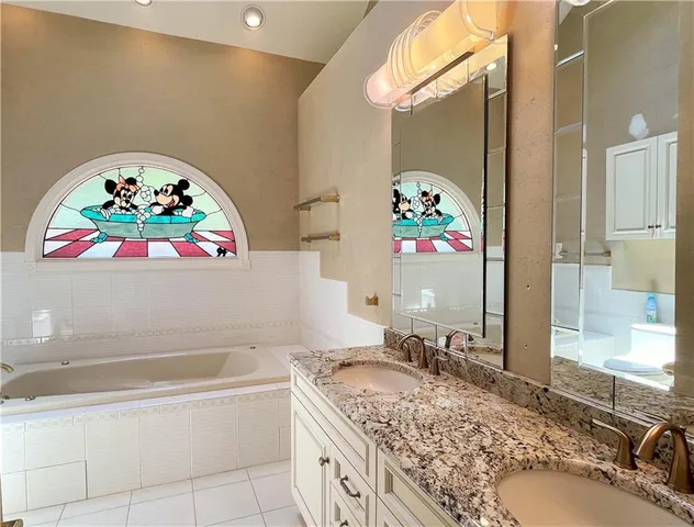 a bathroom with a sink toilet and a mirror