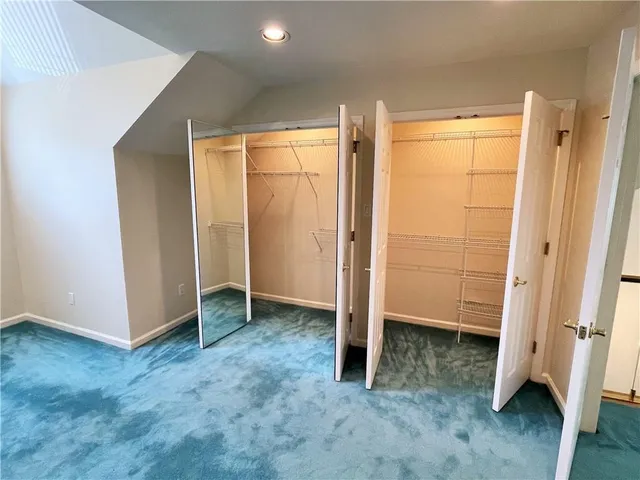 an empty room with wooden floor