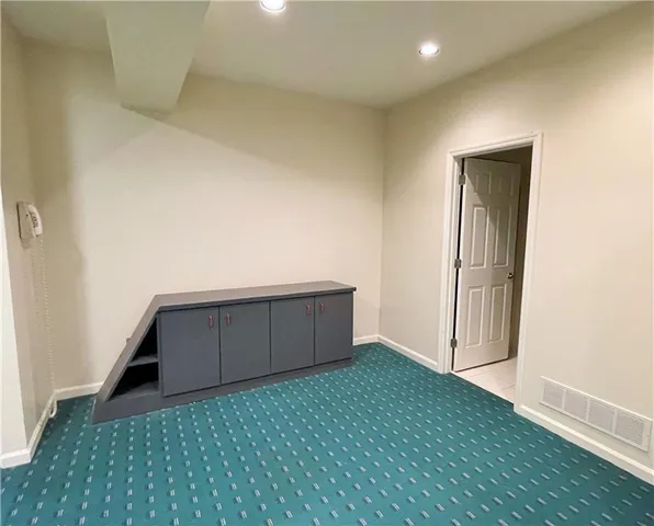 a kitchen with stainless steel appliances a sink and an oven