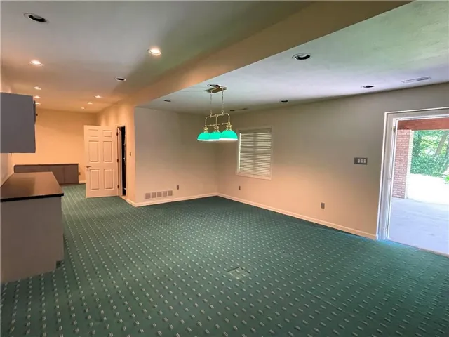 a view of a room with racks on the wall