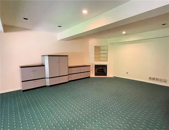 a view of kitchen and hall with wooden floor