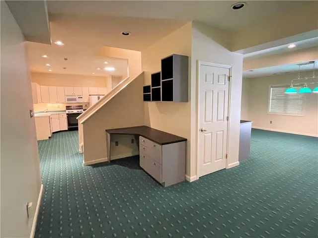 a view of a garden with large trees