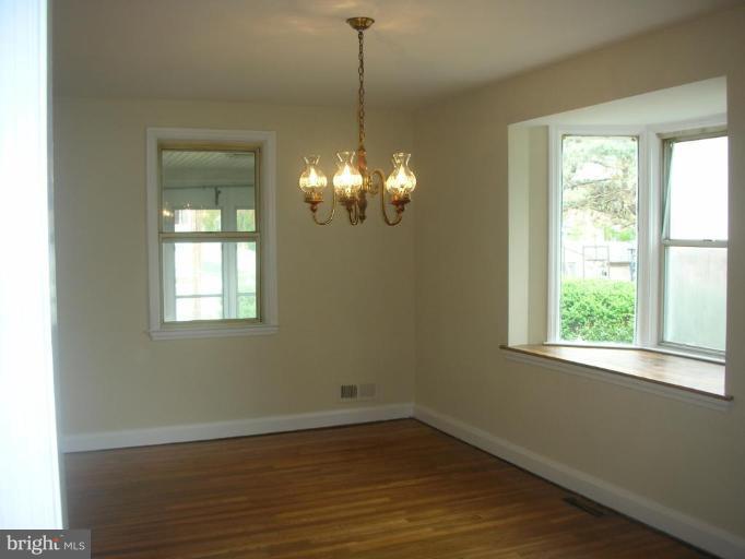 1608 Aberdeen Road Towson, MD 21286 - Photo 12 of 23 a view of a room with wooden floor and windows
