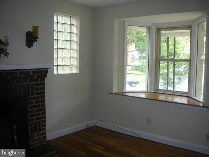 1608 Aberdeen Road Towson, MD 21286 - Photo 16 of 23 an empty room with wooden floor and windows