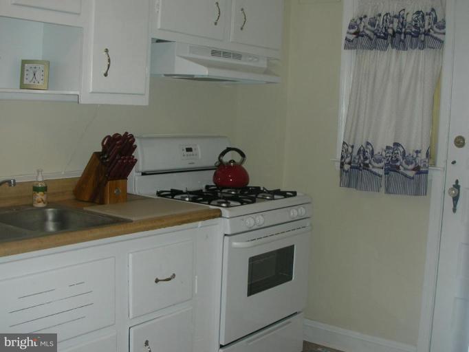 1608 Aberdeen Road Towson, MD 21286 - Photo 17 of 23 a kitchen with a stove and cabinets
