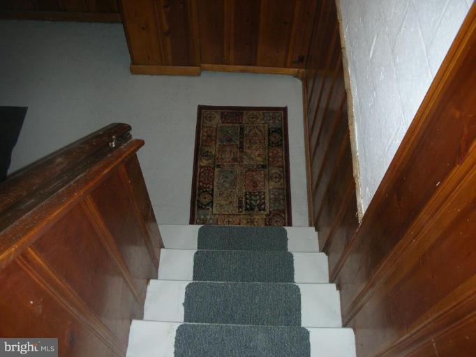 1608 Aberdeen Road Towson, MD 21286 - Photo 22 of 23 a front view of a house with wooden floor and a rug