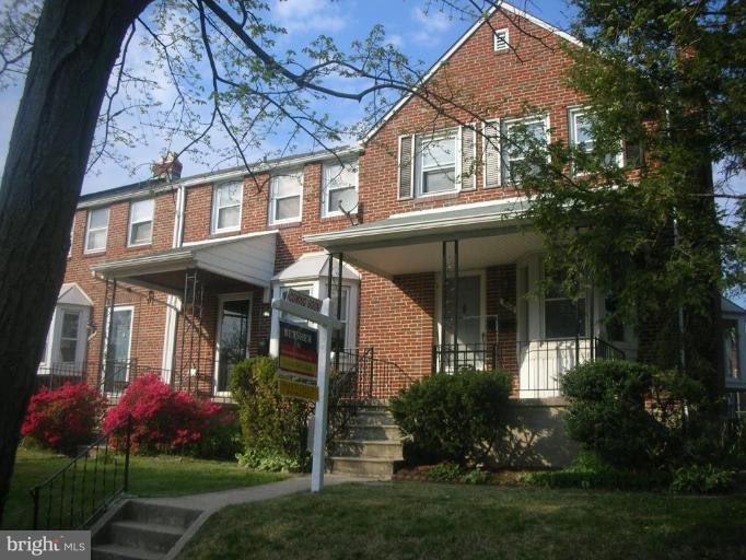 1608 Aberdeen Road Towson, MD 21286 - Photo 6 of 23 front view of house with a yard and potted plants