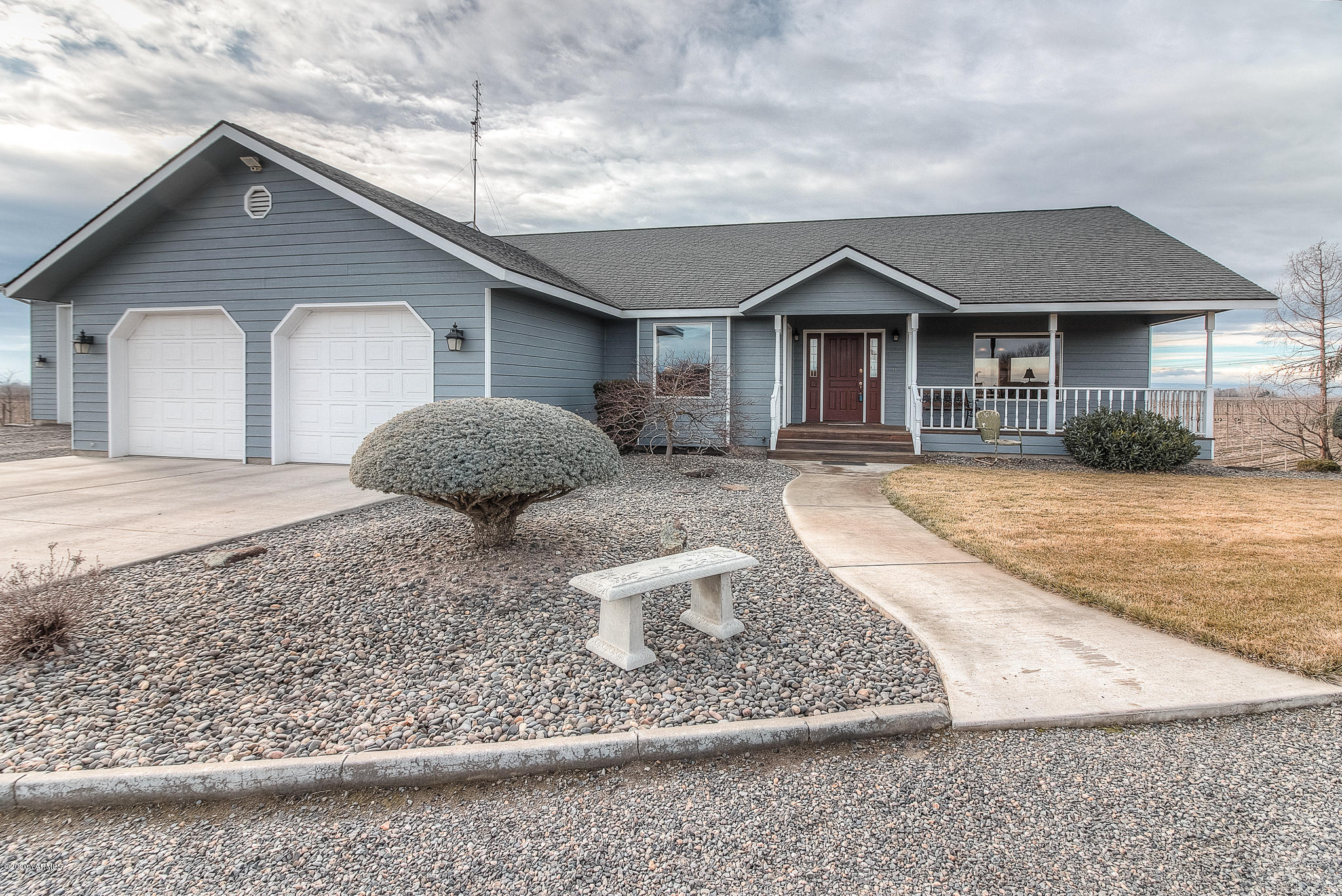 630 Belma Road Grandview, WA 98930 - Photo 1 of 71 a front view of a house with a yard