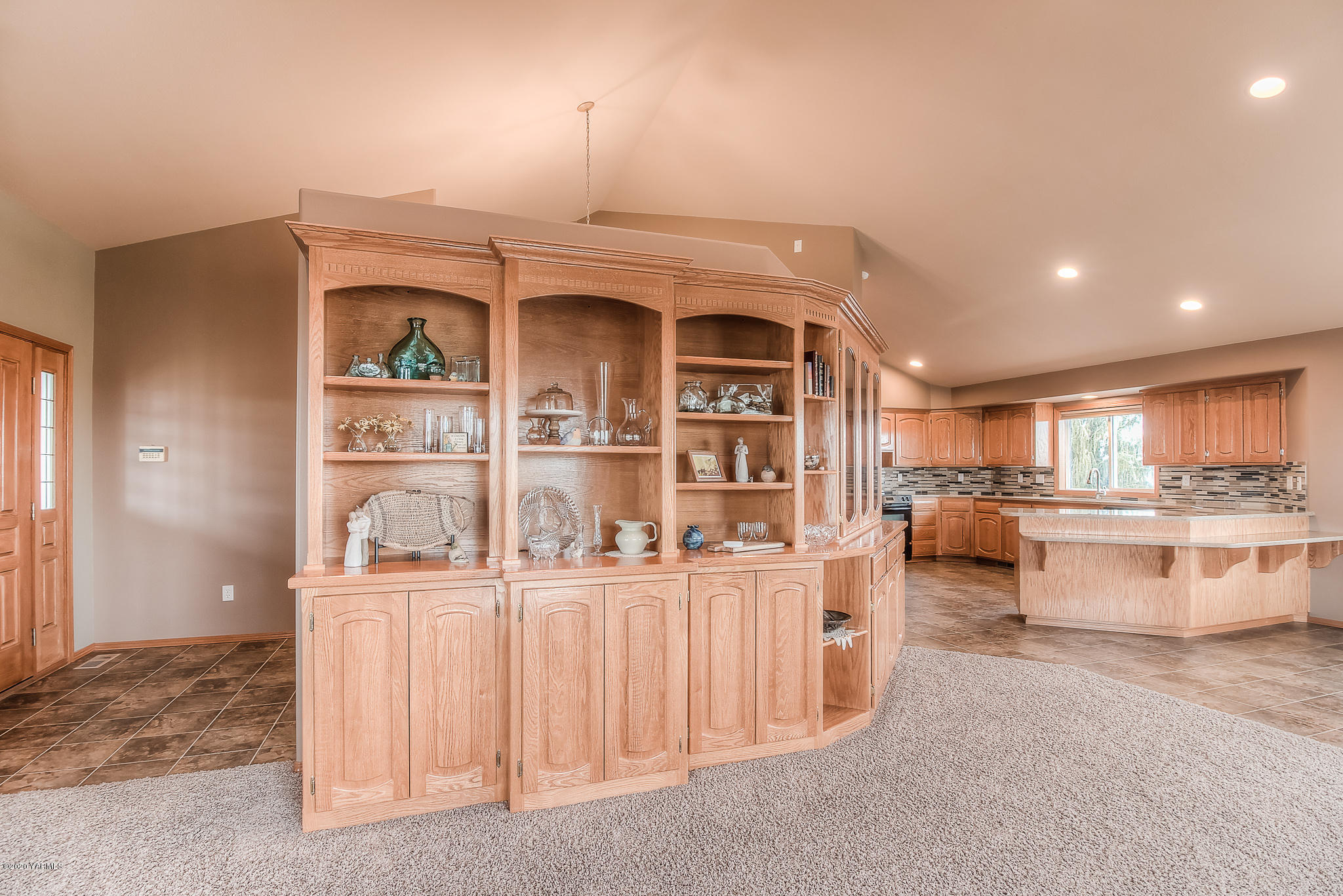 630 Belma Road Grandview, WA 98930 - Photo 17 of 71 a living room with kitchen island furniture and a wooden floor