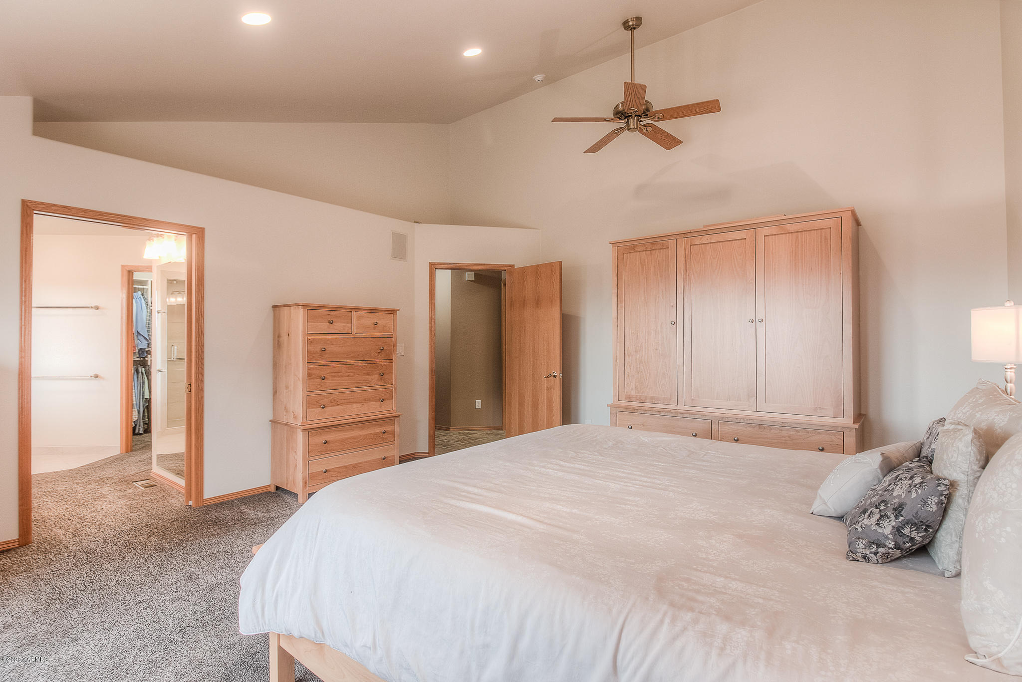630 Belma Road Grandview, WA 98930 - Photo 20 of 71 a bedroom with a bed and a chandelier