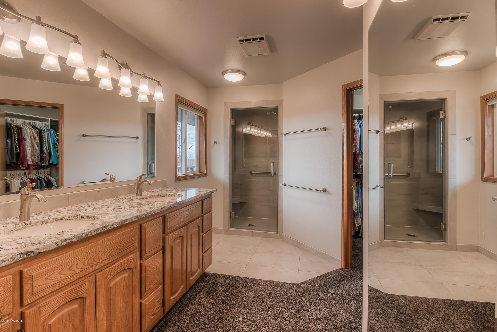 630 Belma Road Grandview, WA 98930 - Photo 23 of 71 a bathroom with a granite countertop sink shower and a mirror