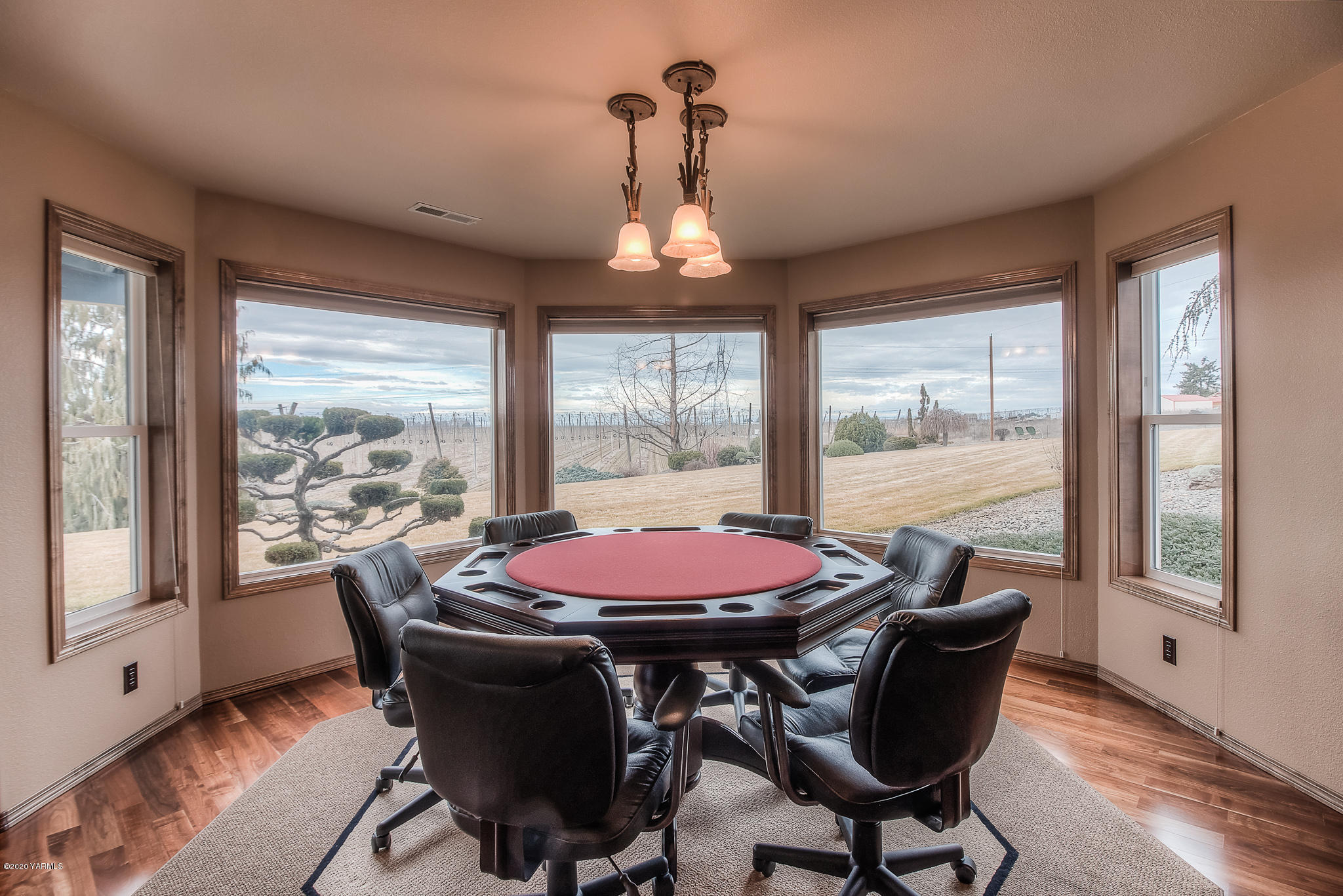 630 Belma Road Grandview, WA 98930 - Photo 30 of 71 a dining room with furniture window and wooden floor