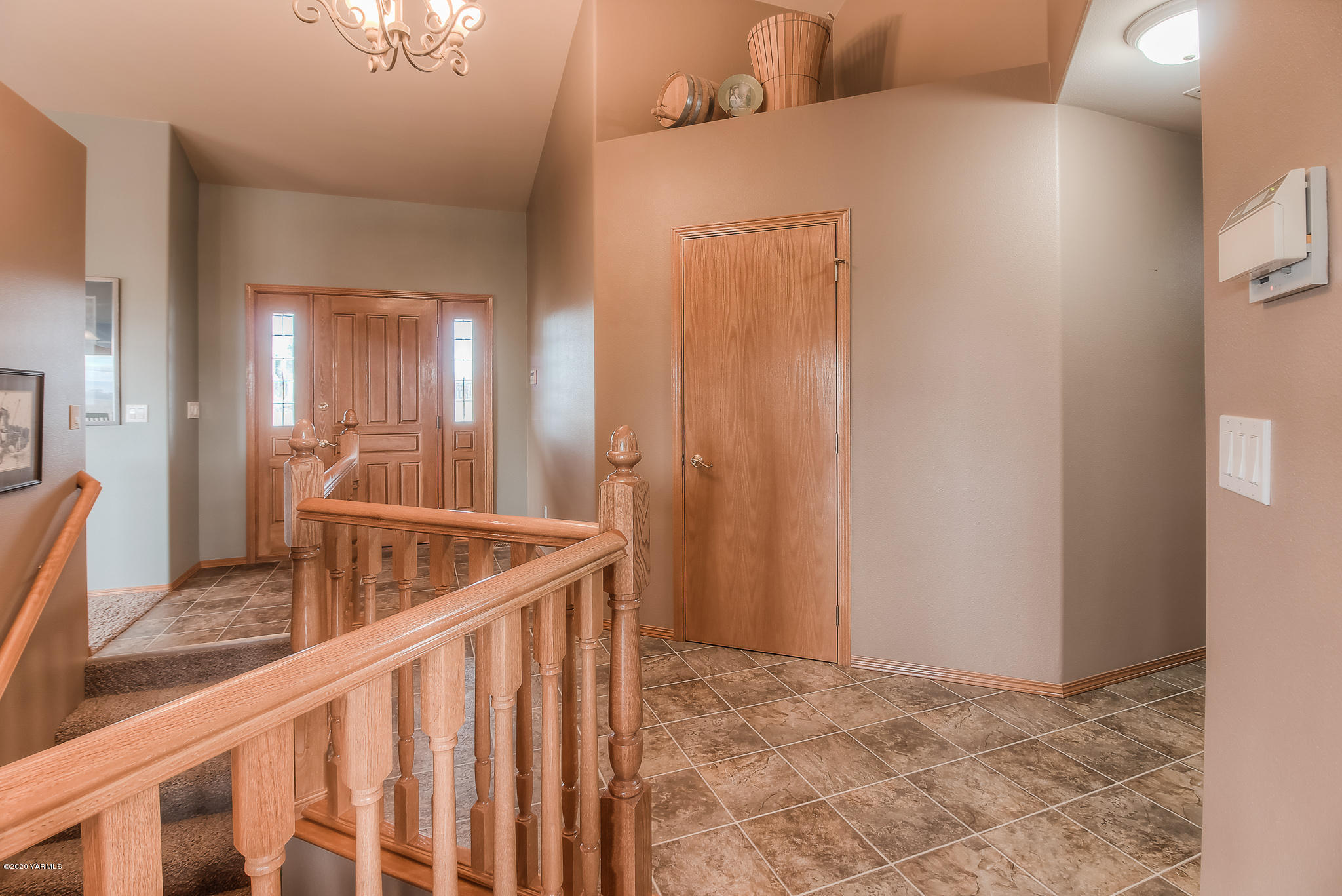 630 Belma Road Grandview, WA 98930 - Photo 4 of 71 a view of a hallway with wooden floor and staircase