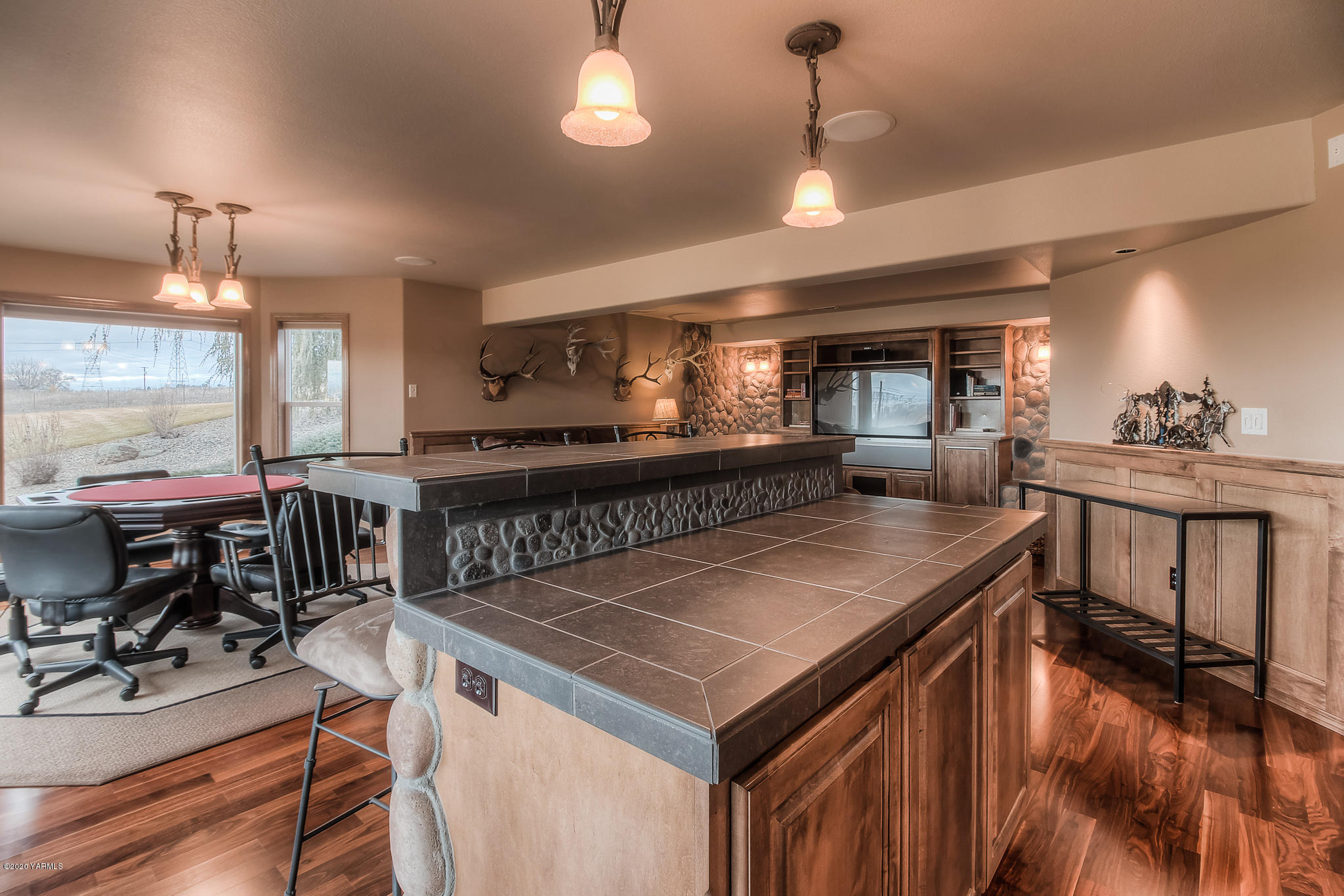 630 Belma Road Grandview, WA 98930 - Photo 33 of 71 a kitchen with a stove a refrigerator a dining table and chairs with wooden floor