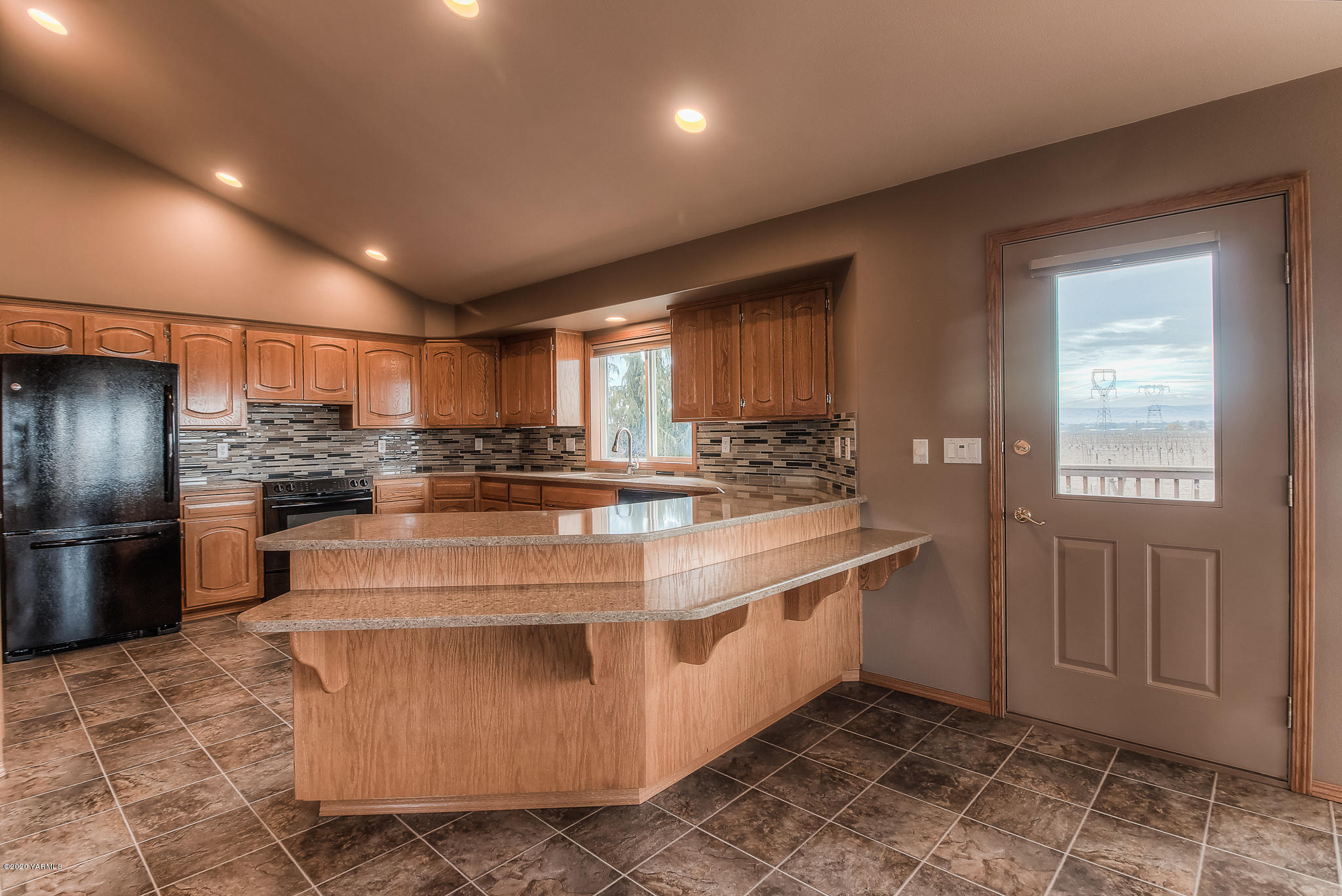 630 Belma Road Grandview, WA 98930 - Photo 8 of 71 a kitchen with stainless steel appliances granite countertop a stove a sink and a refrigerator