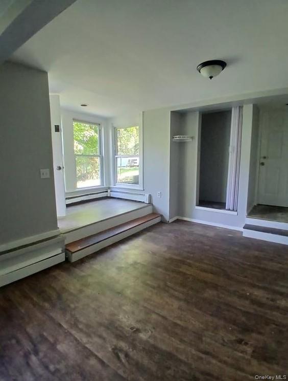 299 South Main Street, Unit #4 Liberty, NY 12754 - Photo 2 of 7 a view of an empty room with wooden floor and a window