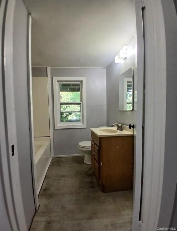 299 South Main Street, Unit #4 Liberty, NY 12754 - Photo 4 of 7 a room with window and mirror