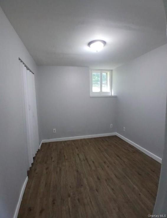299 South Main Street, Unit #4 Liberty, NY 12754 - Photo 5 of 7 an empty room with wooden floor and windows