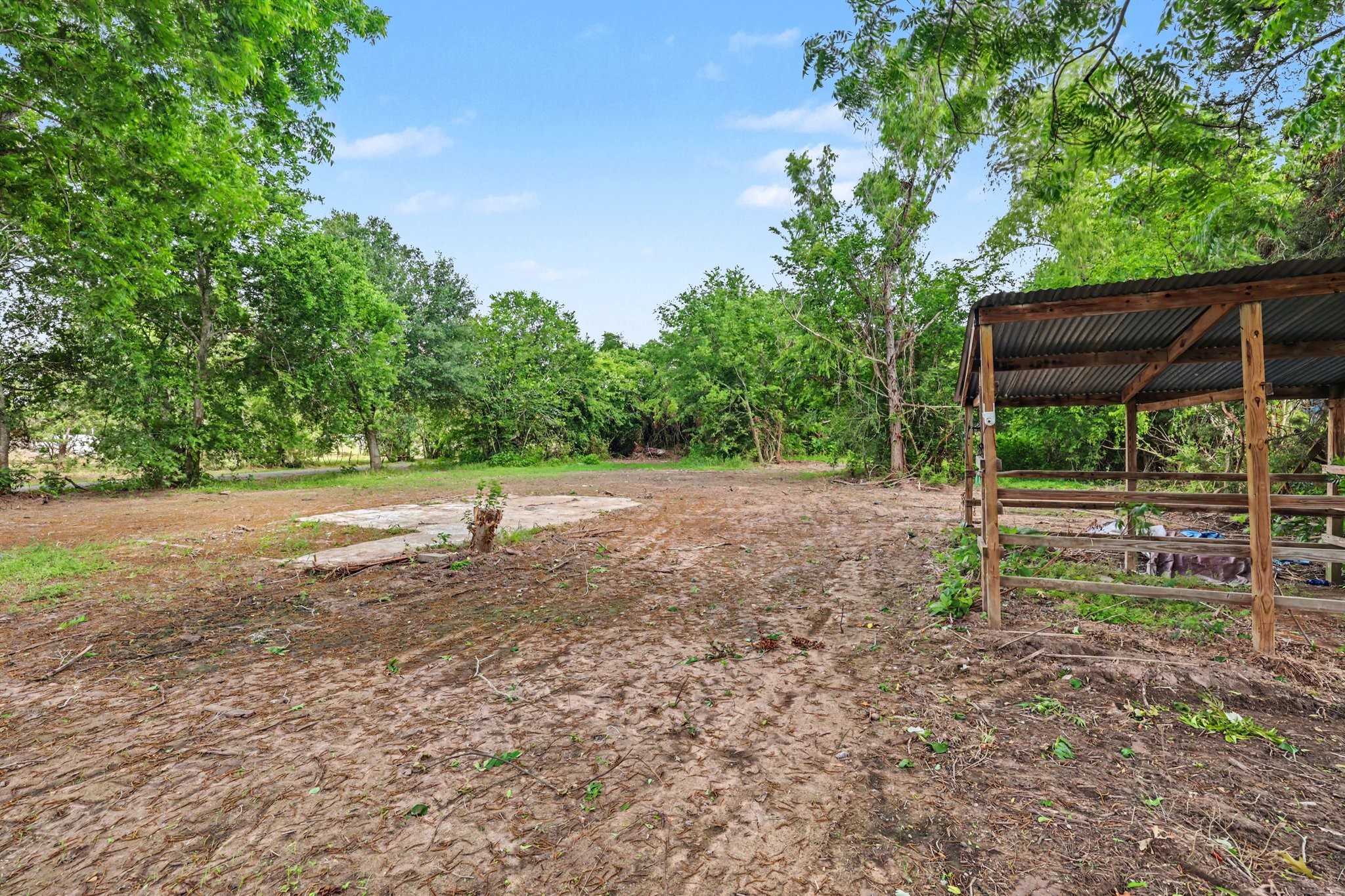 31730 Waller Tomball Road Waller, TX 77484 - Photo 47 of 50 Backyard is surrounded by trees, ideal for gardening and wooden shelter for animal to raise. I