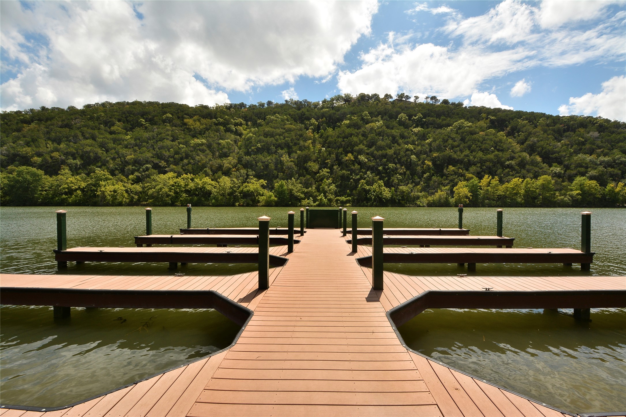 3513 Grimes Ranch Road Austin, TX 78732 - Photo 29 of 32 Dock area with a view of trees and a water view
