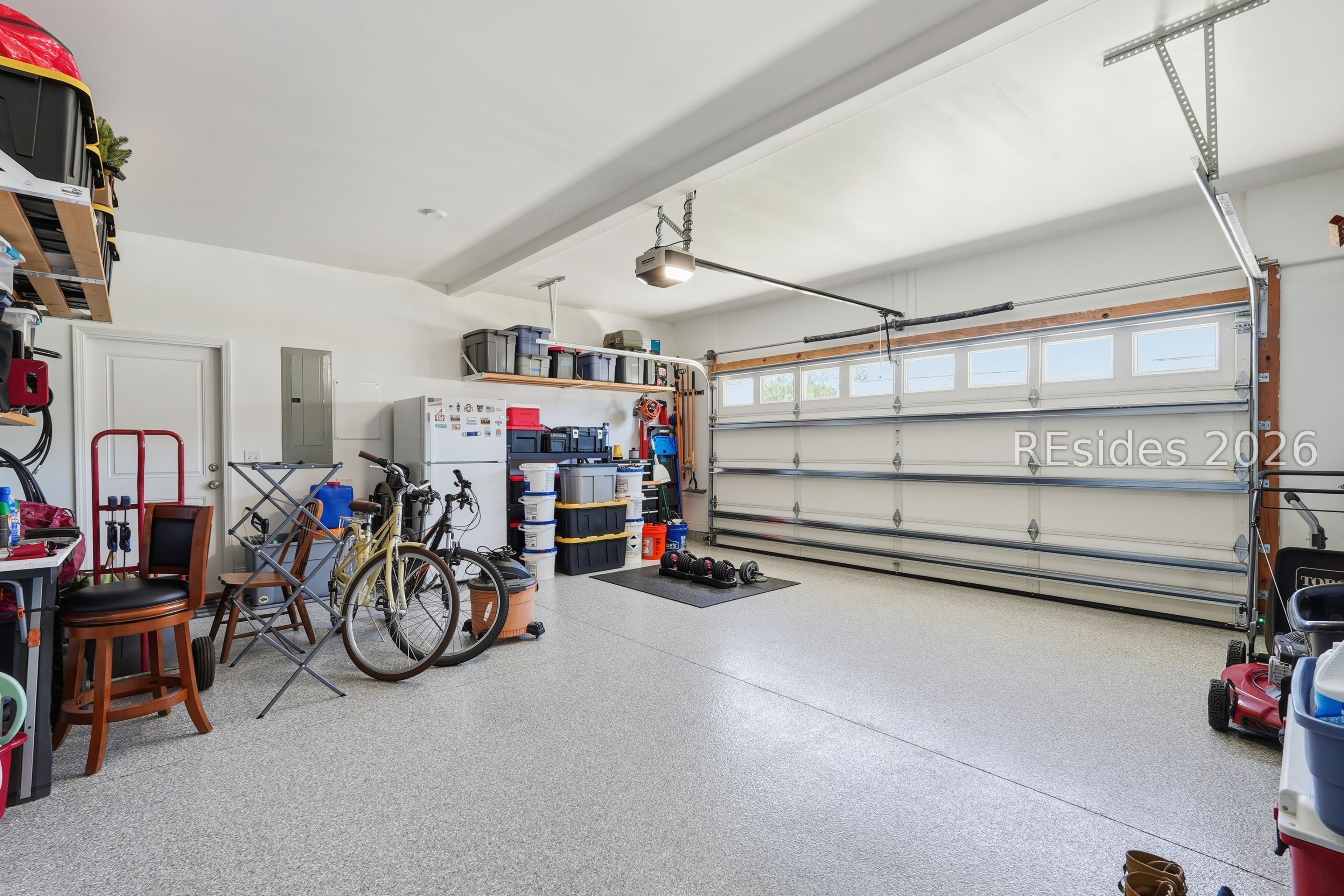 284 Sergeant Jasper Circle Ridgeland, SC 29936 - Photo 41 of 51 Garage with Epoxy Flooring and Heavy-Duty Shelving