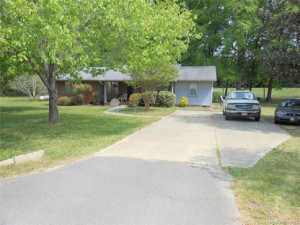 604 Allen Way Indian Trail, NC 28079 - Photo 1 of 4 a car parked in front of a house and a yard