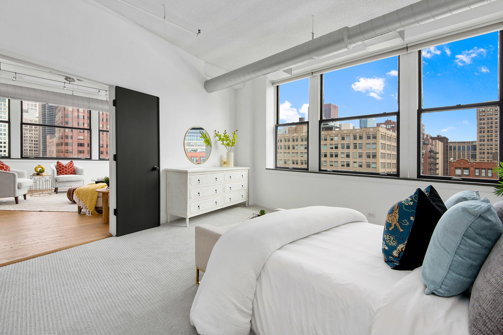 161 West Harrison Street, Unit 802 Chicago, IL 60605 - Photo 13 of 19 a bedroom with a bed couch and a large window