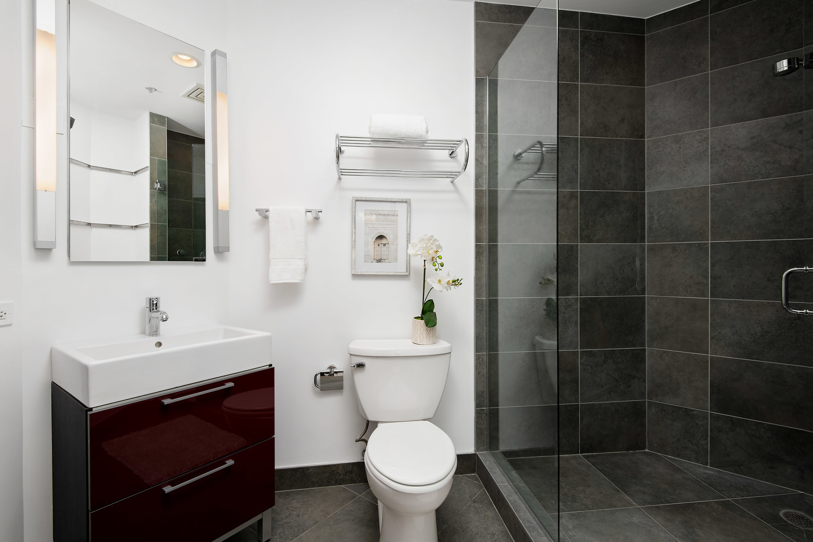 161 West Harrison Street, Unit 802 Chicago, IL 60605 - Photo 17 of 19 a bathroom with a toilet sink and mirror