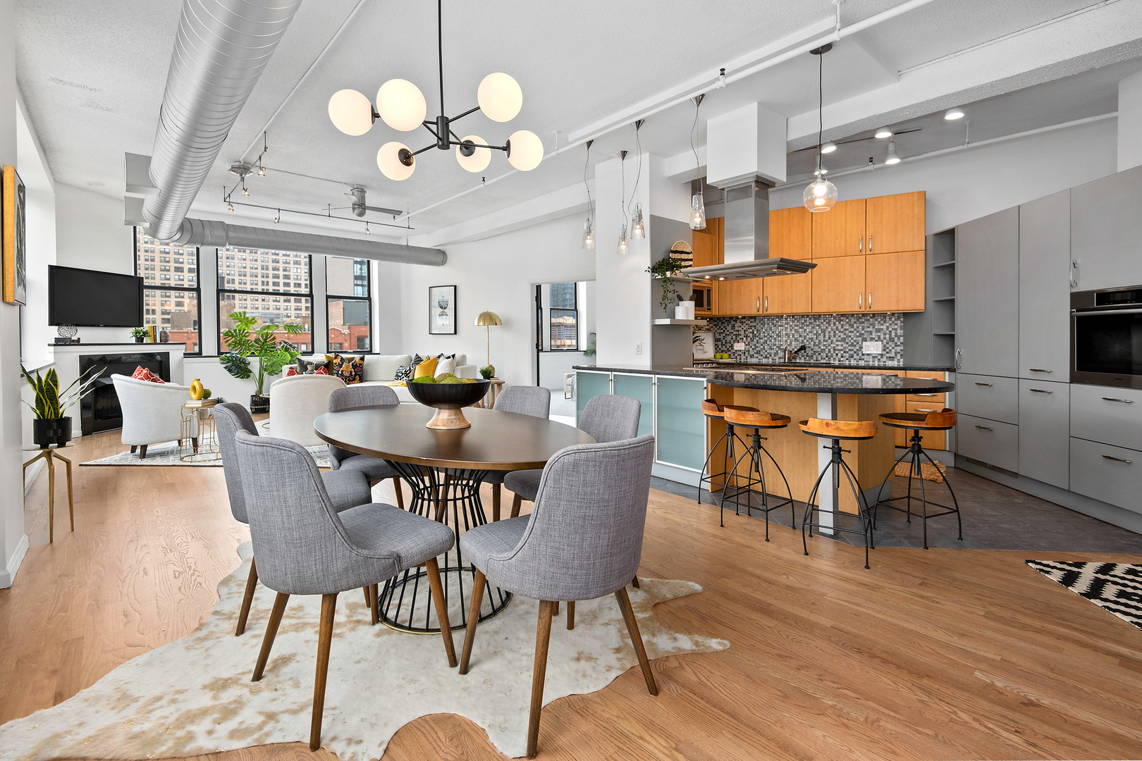 161 West Harrison Street, Unit 802 Chicago, IL 60605 - Photo 8 of 19 a view of a dining room with furniture wooden floor and chandelier