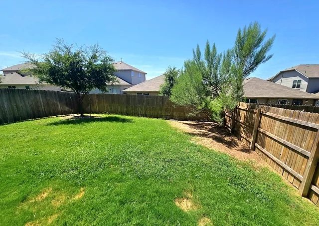 a view of a backyard with a garden
