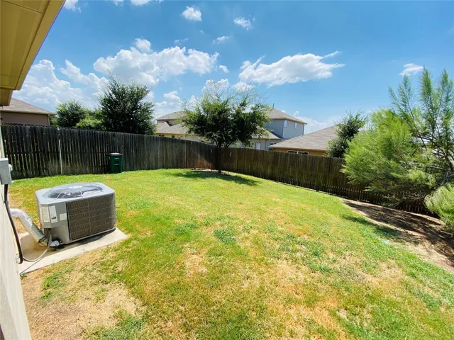 a swimming pool with some trees in the background