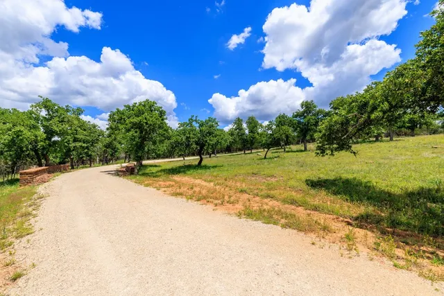 a view of a playground with basketball court