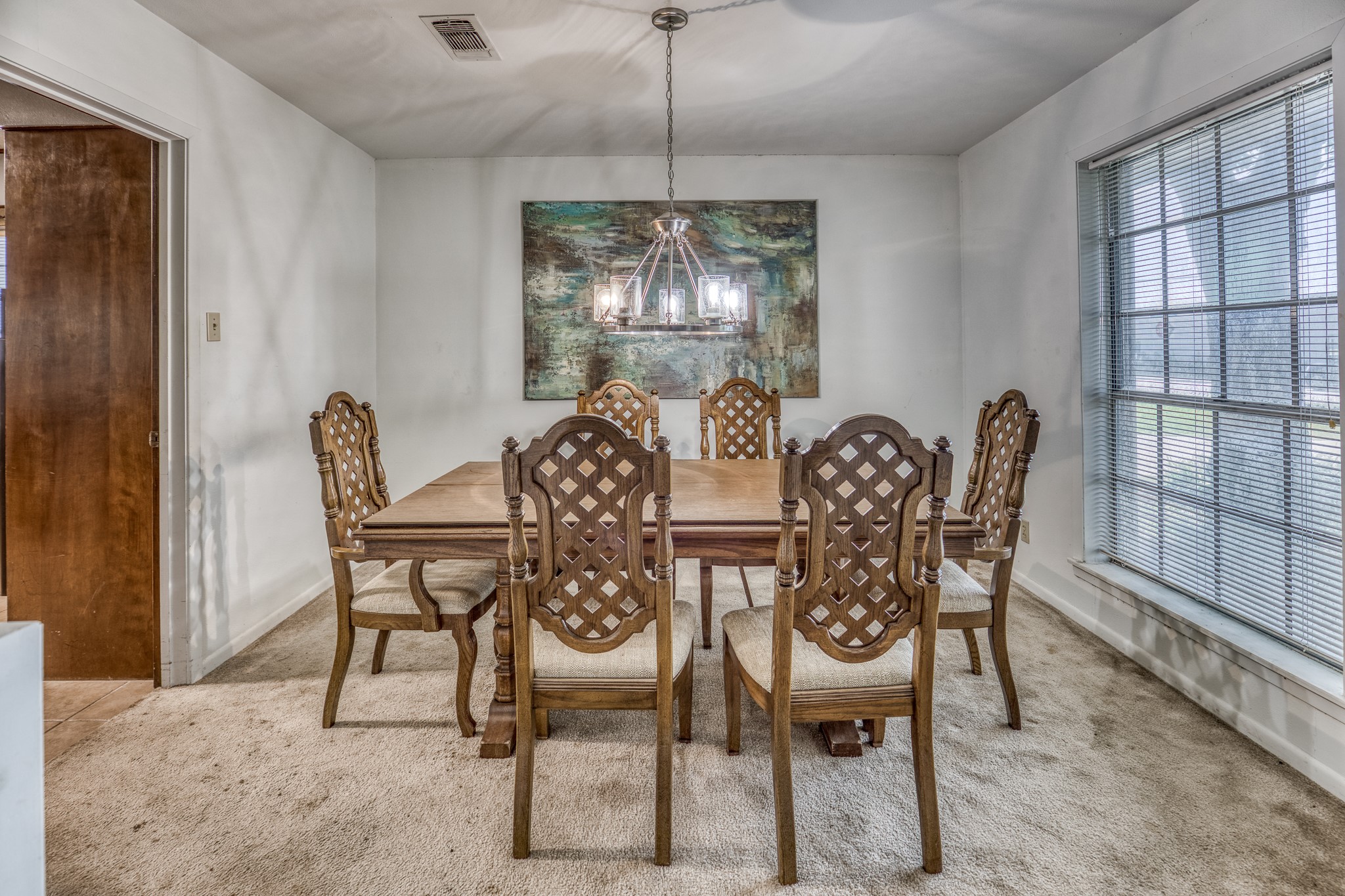 1687 Eagle Lake Road Sealy, TX 77474 - Photo 8 of 27 a view of a dining room with furniture and chandelier