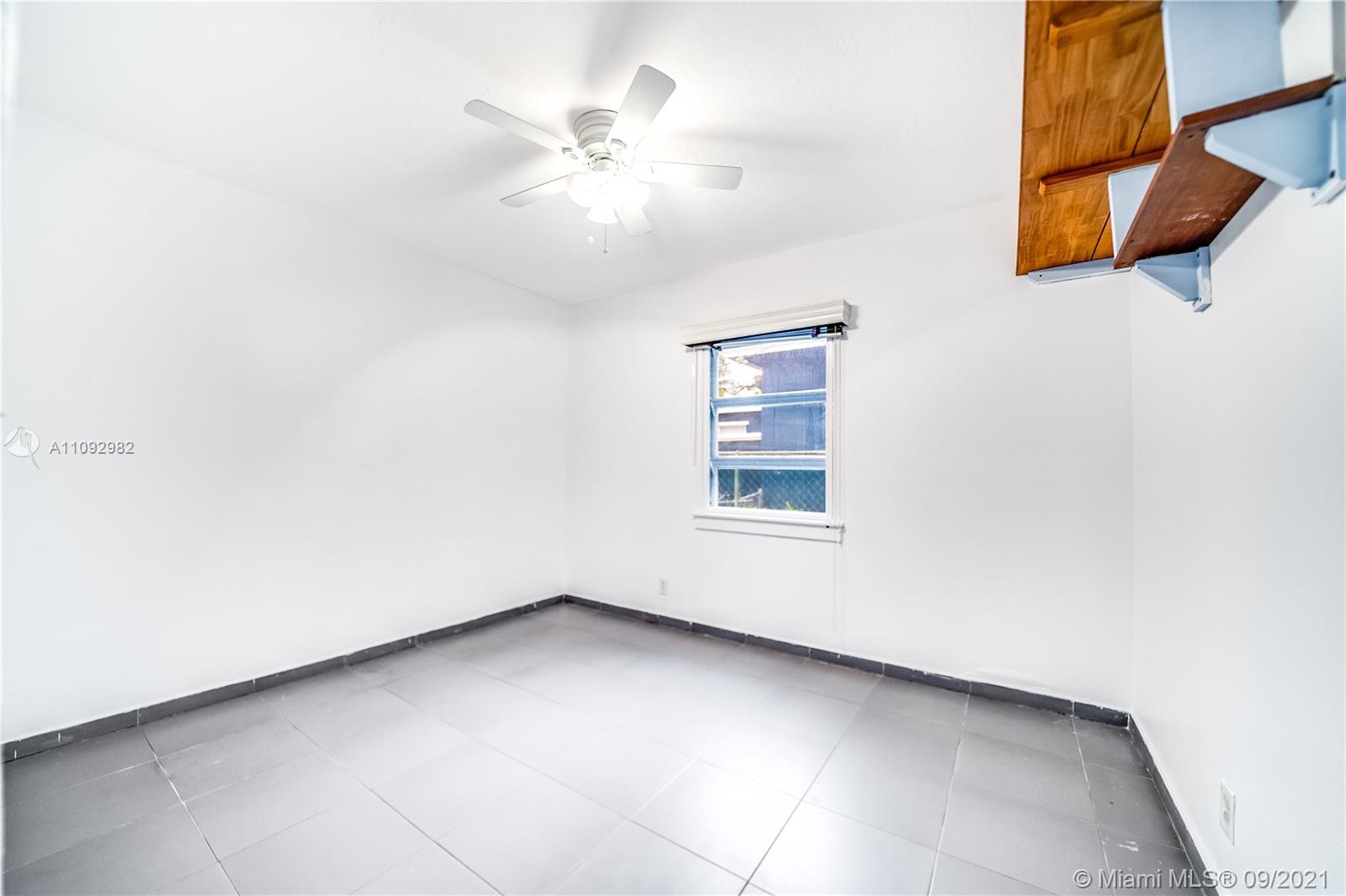 209 Southwest 5th Street Dania Beach, FL 33004 - Photo 18 of 20 an empty room with windows