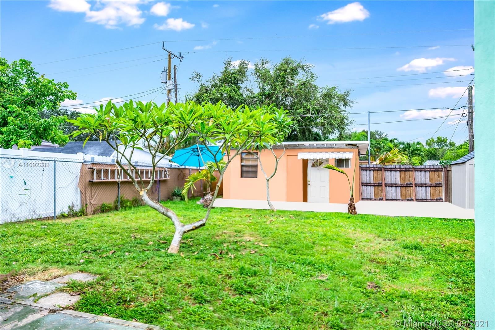 209 Southwest 5th Street Dania Beach, FL 33004 - Photo 4 of 20 a house view with a sitting space and garden