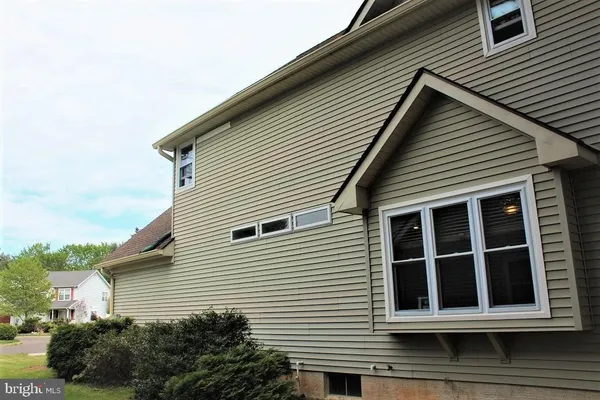 a view of a house with a yard and plants