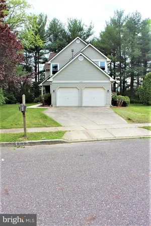 a view of road with house in the background