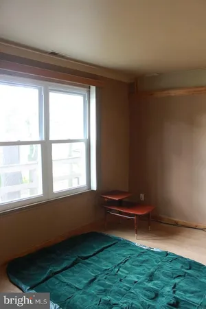 a bathroom with a granite countertop toilet and a sink