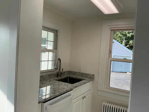a kitchen with a sink and a window