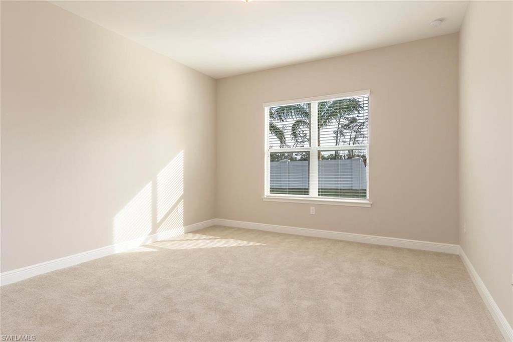 3331 Pilot Circle Naples, FL 34120 - Photo 12 of 28 an empty room with a window