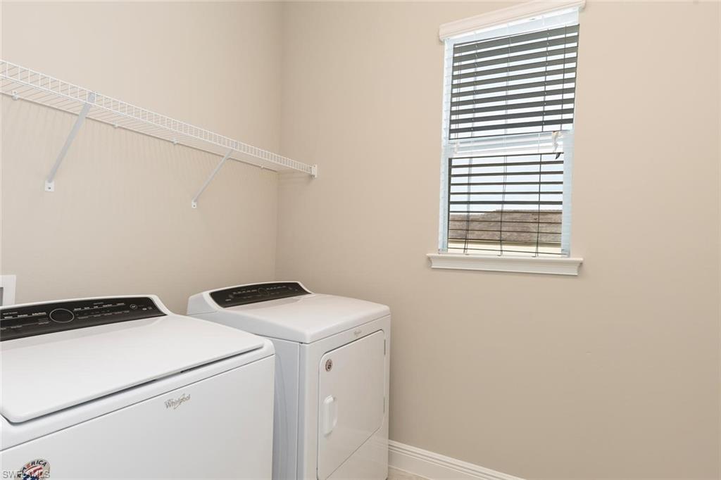 3331 Pilot Circle Naples, FL 34120 - Photo 19 of 28 a utility room with dryer and washer