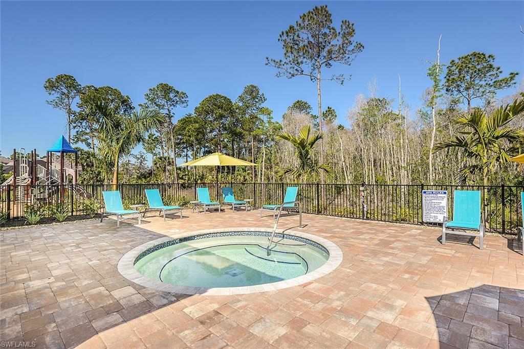 3331 Pilot Circle Naples, FL 34120 - Photo 27 of 28 a swimming pool with outdoor seating and yard