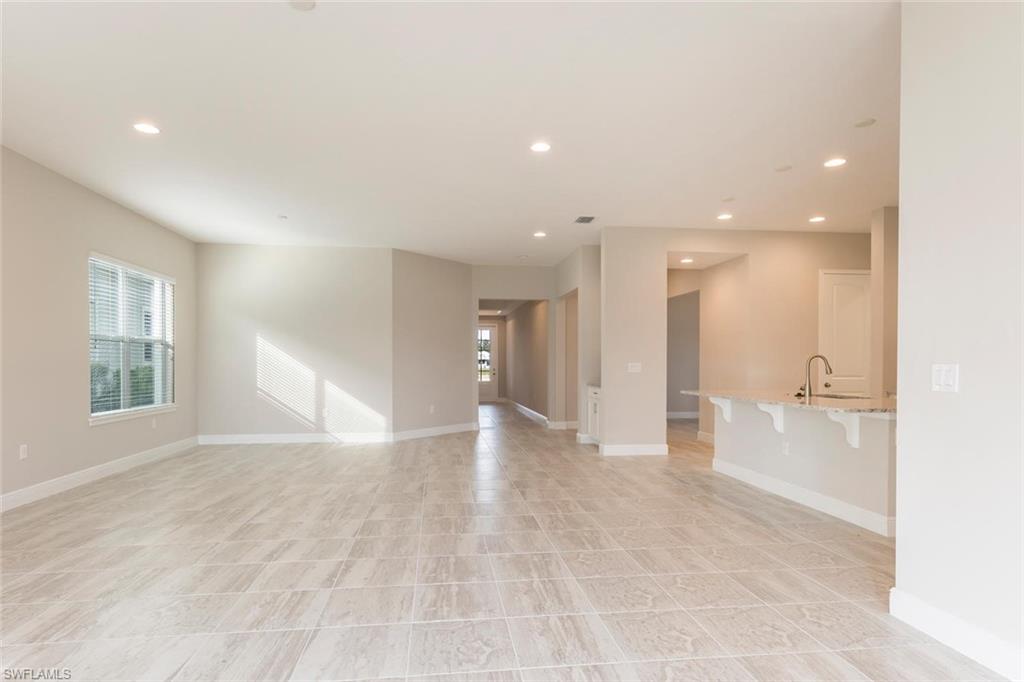 3331 Pilot Circle Naples, FL 34120 - Photo 4 of 28 a view of an empty room with a window