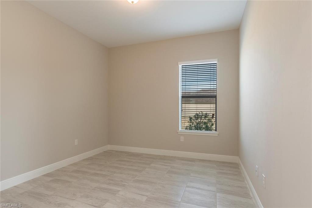 3331 Pilot Circle Naples, FL 34120 - Photo 6 of 28 an empty room with a window